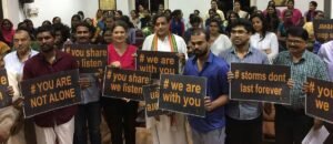 Sashi Tharoor and others holding placards at Vlisten Initiative inaugration event Nov, 2016