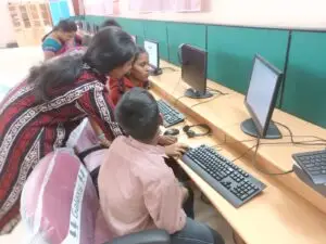 Sreedevi helping differentlyabled children at Vincent Ferrer RDT school March 2023