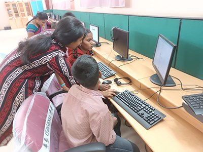 Sreedevi helping differentlyabled children at Vincent Ferrer RDT school Answer questions